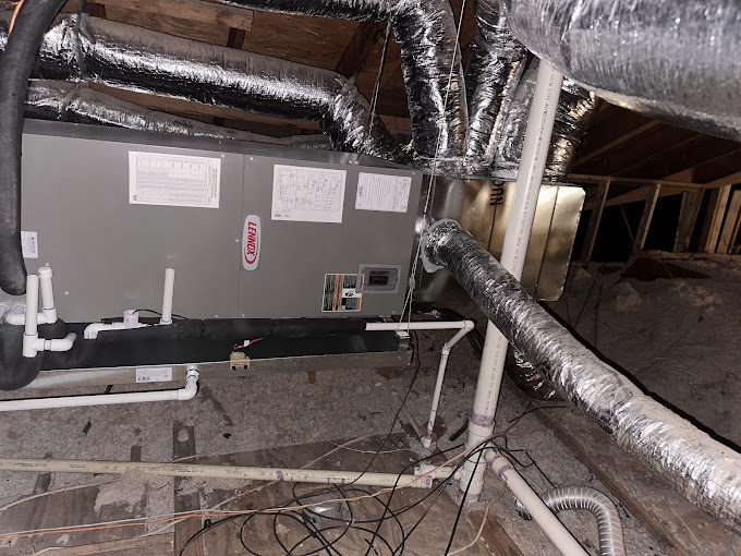 Boost Air technician performing a furnace repair on a residential unit